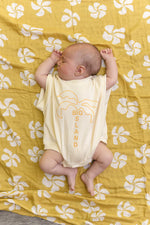 CINNAMON BABY MUSTARD HONOLULU SWADDLE