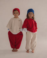 CINNAMON BABY PRIMARY TRACK PANTS - RED