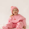 Cinnamon baby tracksuit with fairy floss pink accents, soft cotton blend unisex toddler outfit for comfy everyday wear.