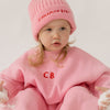 Cinnamon baby tracksuit with fairy floss pink accents, soft cotton blend unisex toddler outfit for comfy everyday wear.