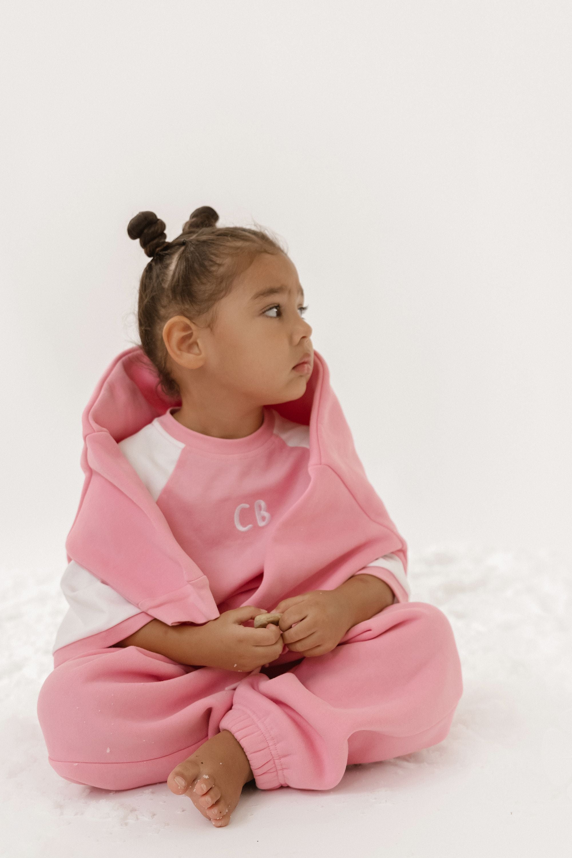 Cinnamon baby raglan tee with pink fairy floss sleeves – soft cotton toddler shirt for stylish everyday wear.