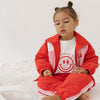 Cinnamon baby spray jacket in cherry red, lightweight and water-resistant toddler outerwear for all-weather comfort.