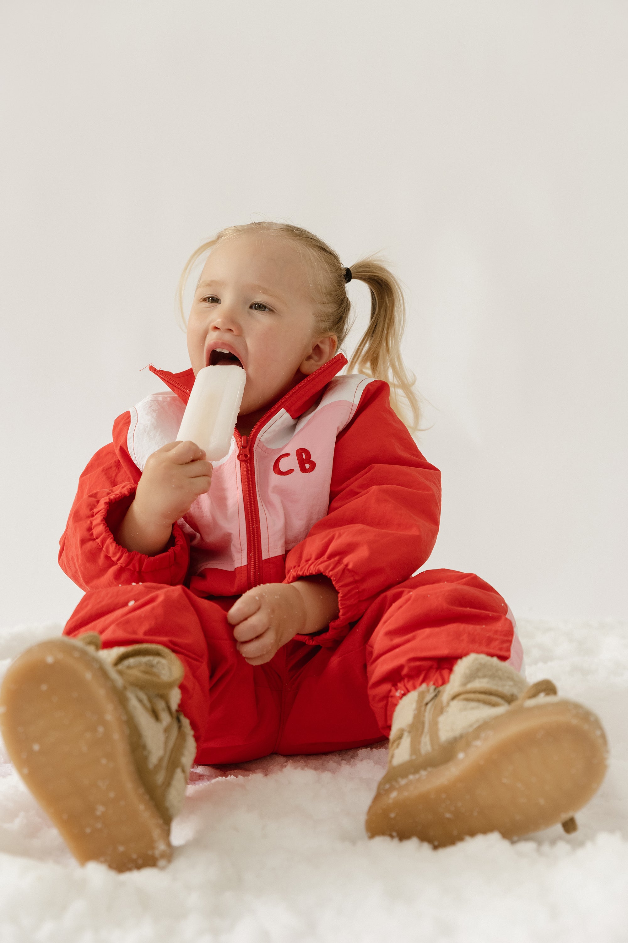 Cinnamon baby spray jacket in cherry red, lightweight and water-resistant toddler outerwear for all-weather comfort.