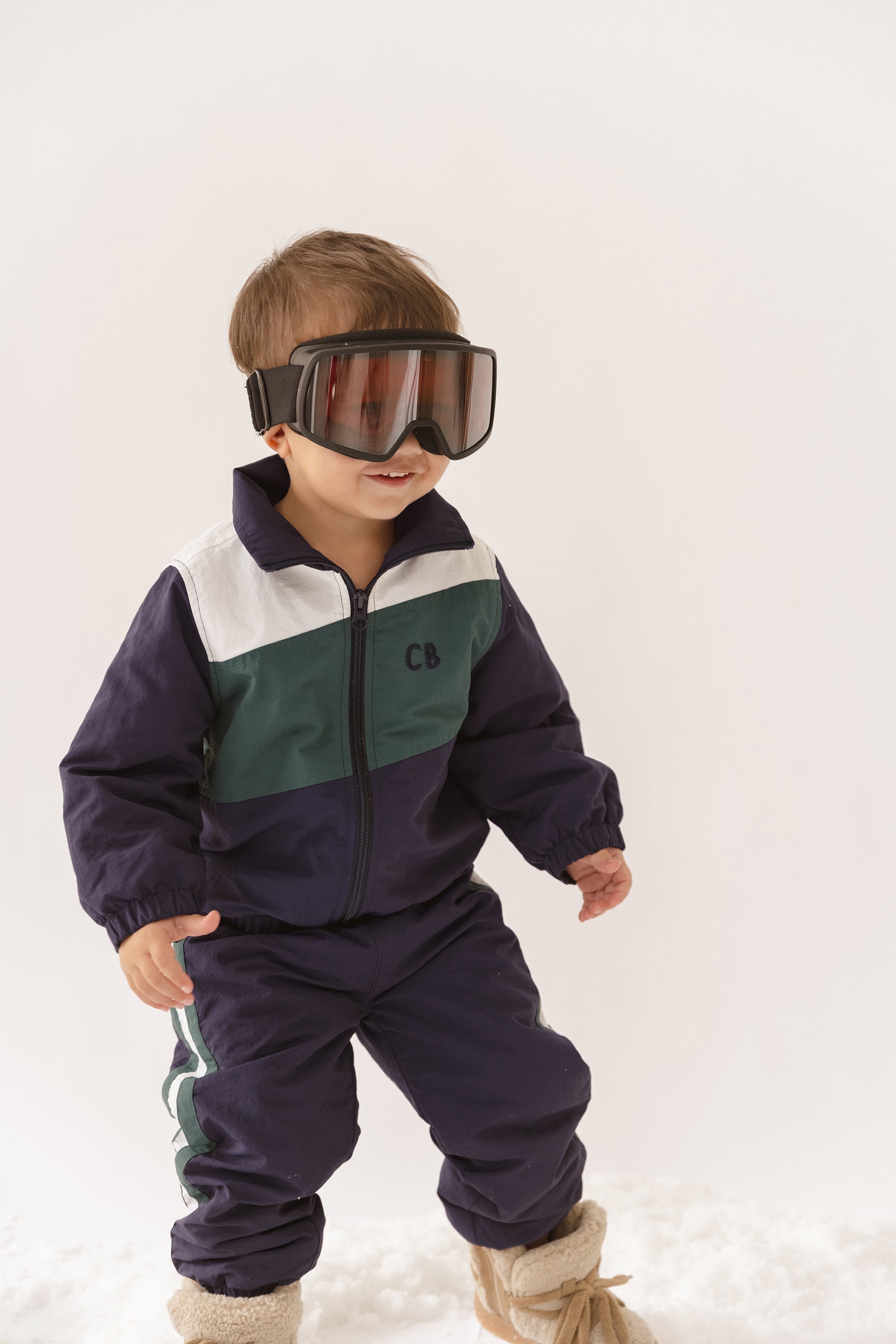 Cinnamon baby spray jacket in navy blue, lightweight and water-resistant toddler outerwear for everyday wear.