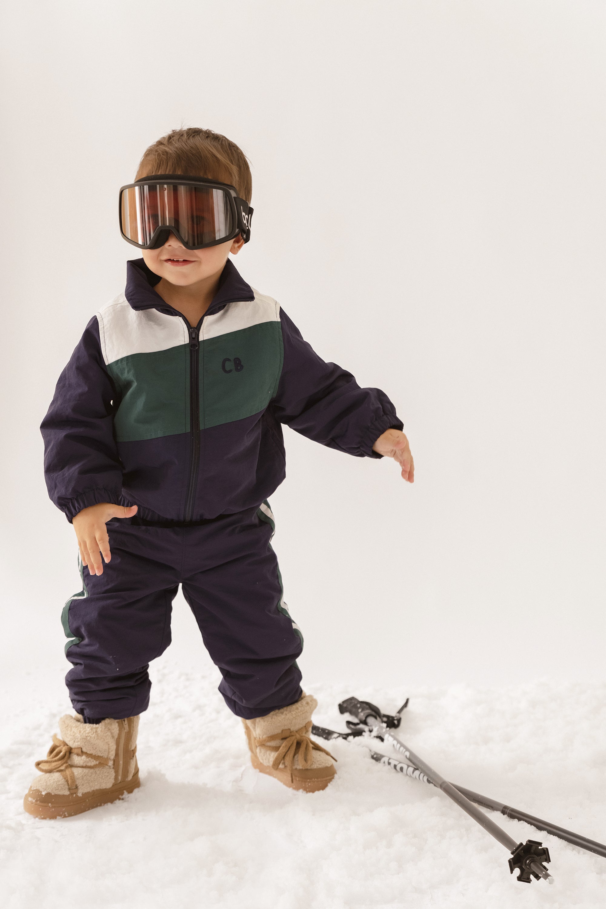 Cinnamon baby spray jacket in navy blue, lightweight and water-resistant toddler outerwear for everyday wear.